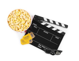 Photo of Movie clapper, bucket of tasty popcorn, cinema tickets and glasses isolated on white, top view