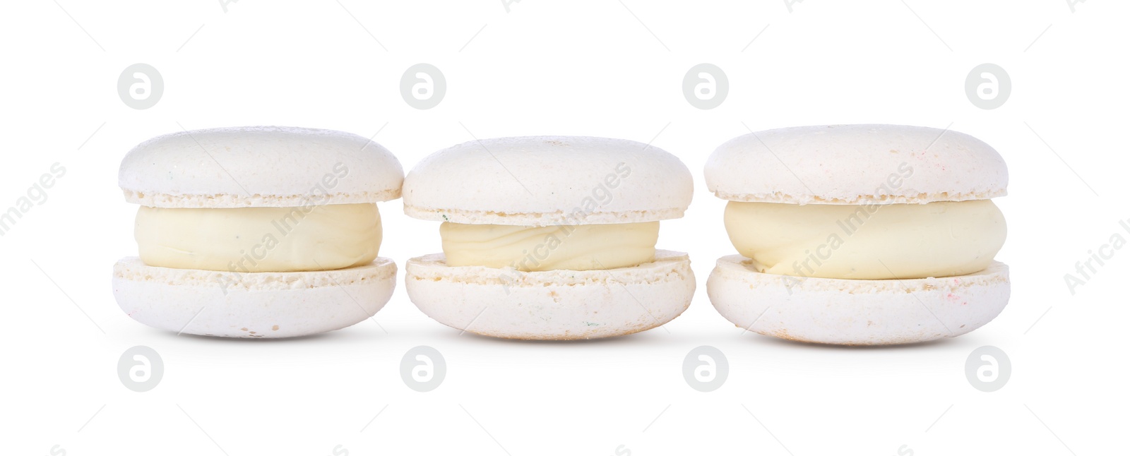 Photo of Three delicious sweet macarons isolated on white
