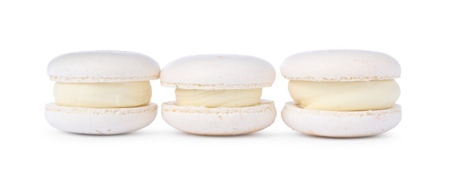 Photo of Three delicious sweet macarons isolated on white