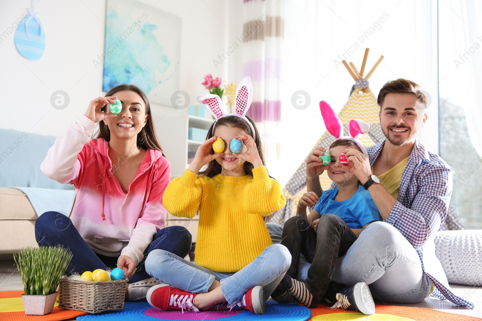 Photo of Happy family spending time together during Easter holiday at home
