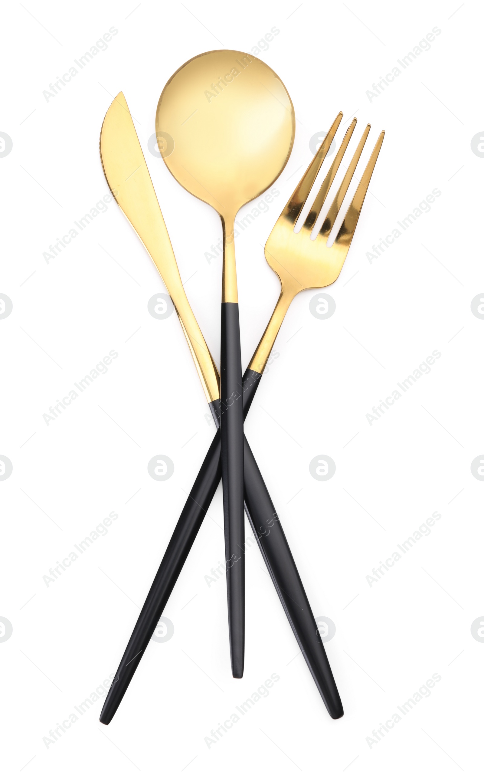 Photo of Shiny golden fork, spoon and knife isolated on white. Luxury cutlery