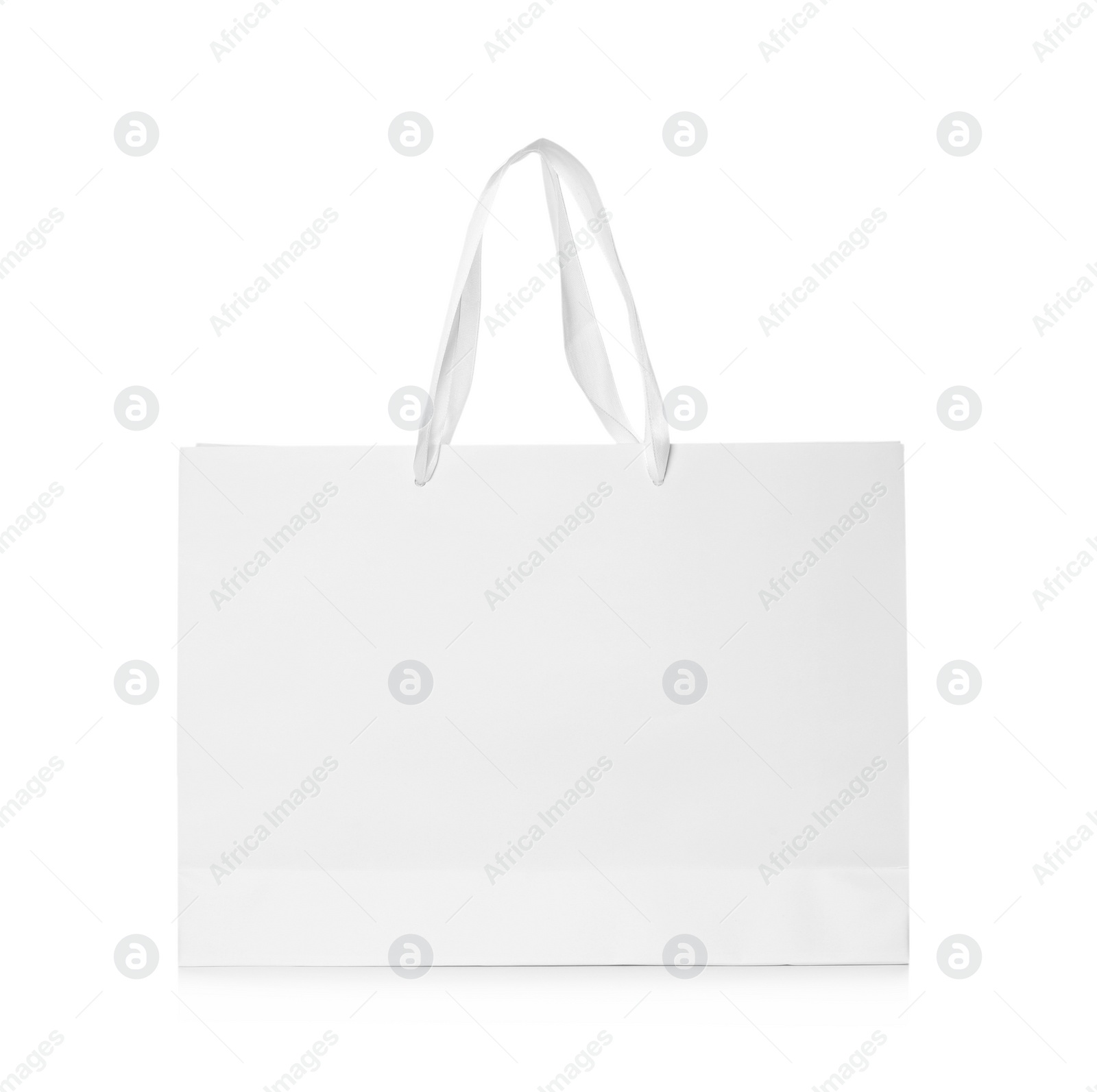 Photo of Paper shopping bag isolated on white. Mock up for design