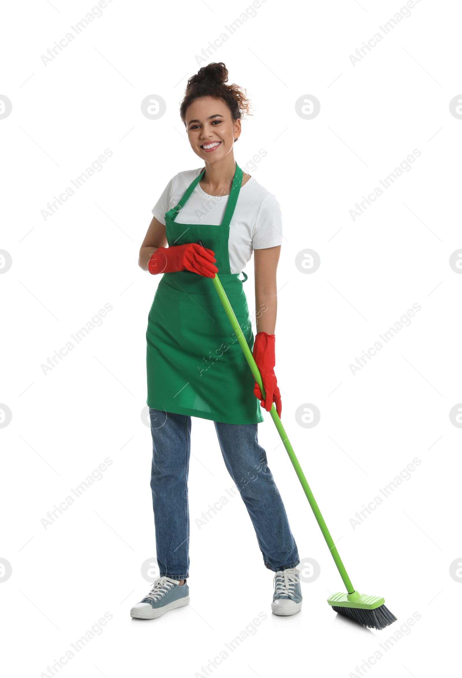 Photo of African American woman with green broom on white background
