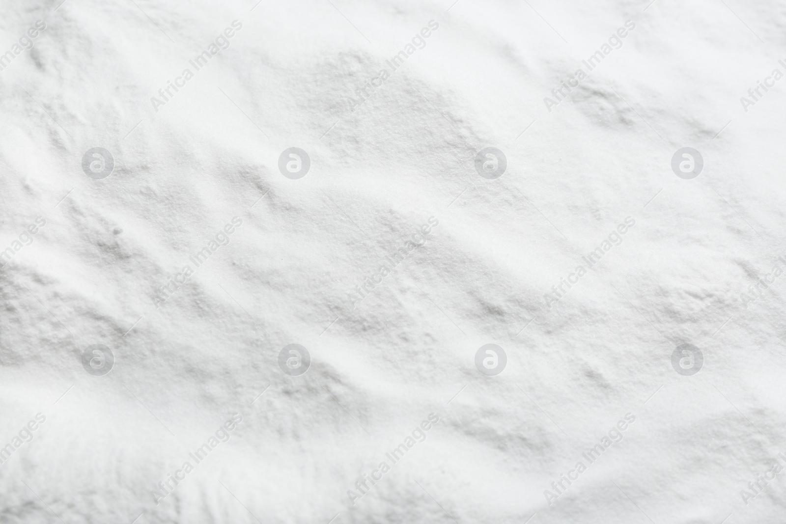 Photo of Pure baking soda as background, closeup view