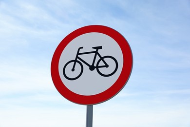 Photo of Traffic sign NO BICYCLE against blue sky