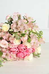 Photo of Beautiful bouquet of fresh flowers on table, closeup
