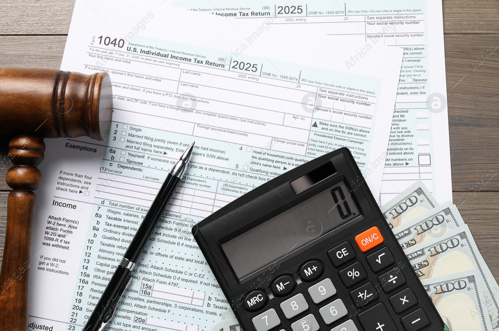 Photo of Tax law. Flat lay composition with gavel and forms on wooden table