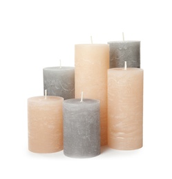 Photo of Many color wax candles on white background