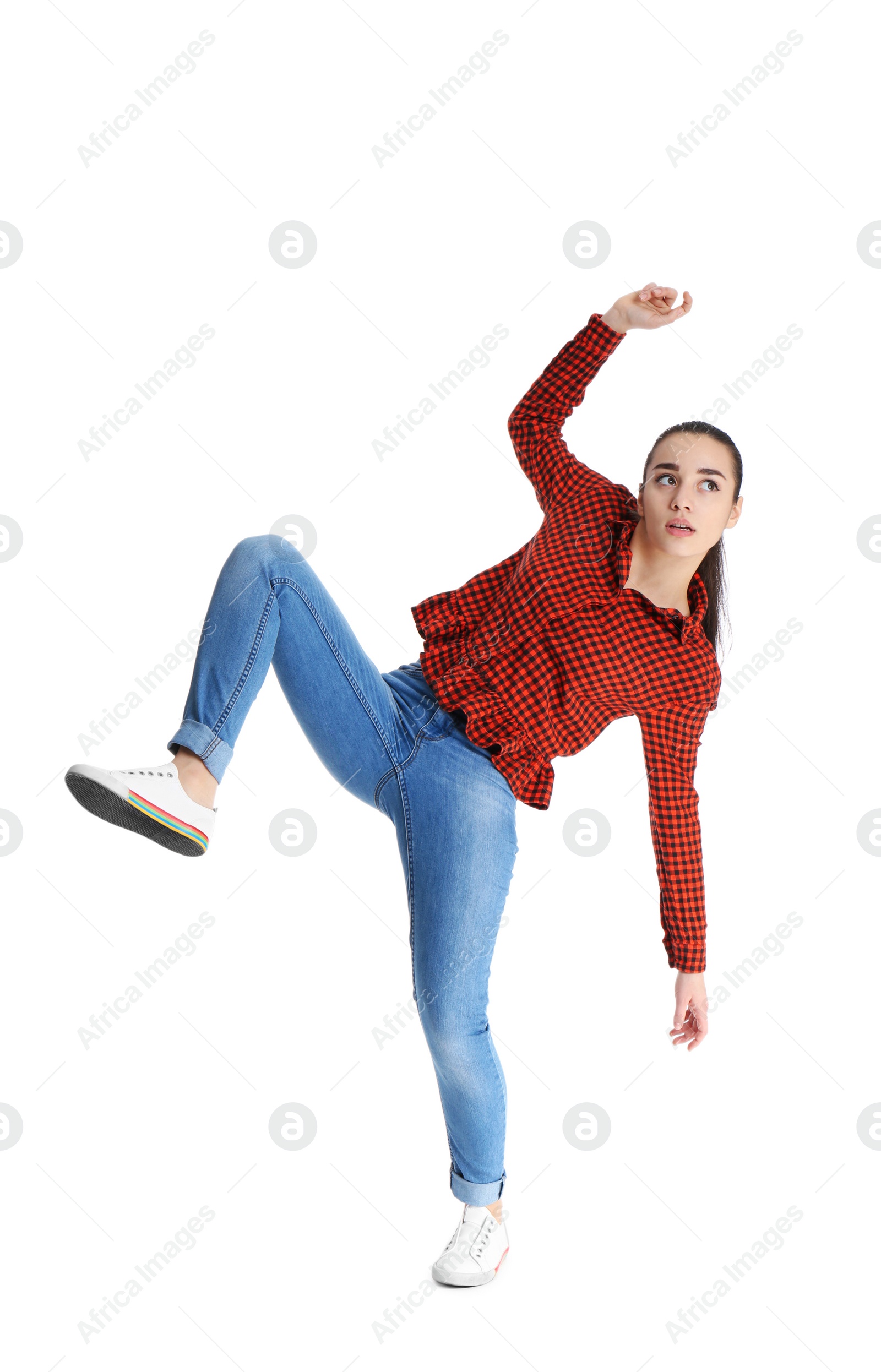 Photo of Young woman attracted to magnet on white background