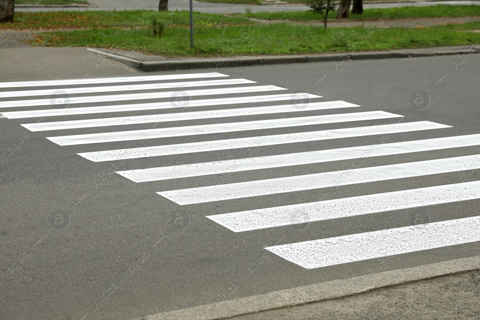 Photo of Pedestrian crossing on empty city street, closeup