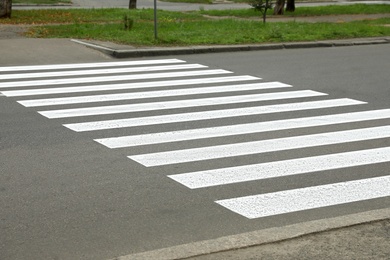Photo of Pedestrian crossing on empty city street, closeup