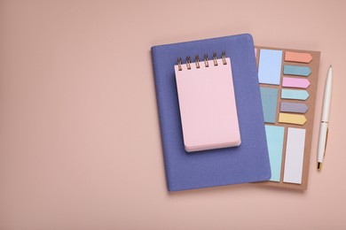 Photo of Blank notebook, planner and stationery on beige background, flat lay. Space for text