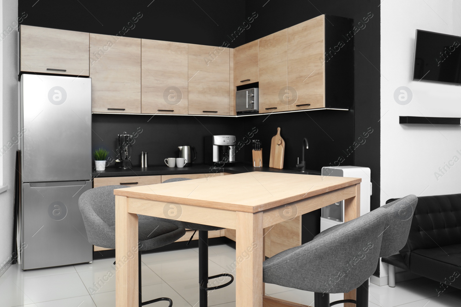 Photo of Cozy modern kitchen interior with new furniture and appliances