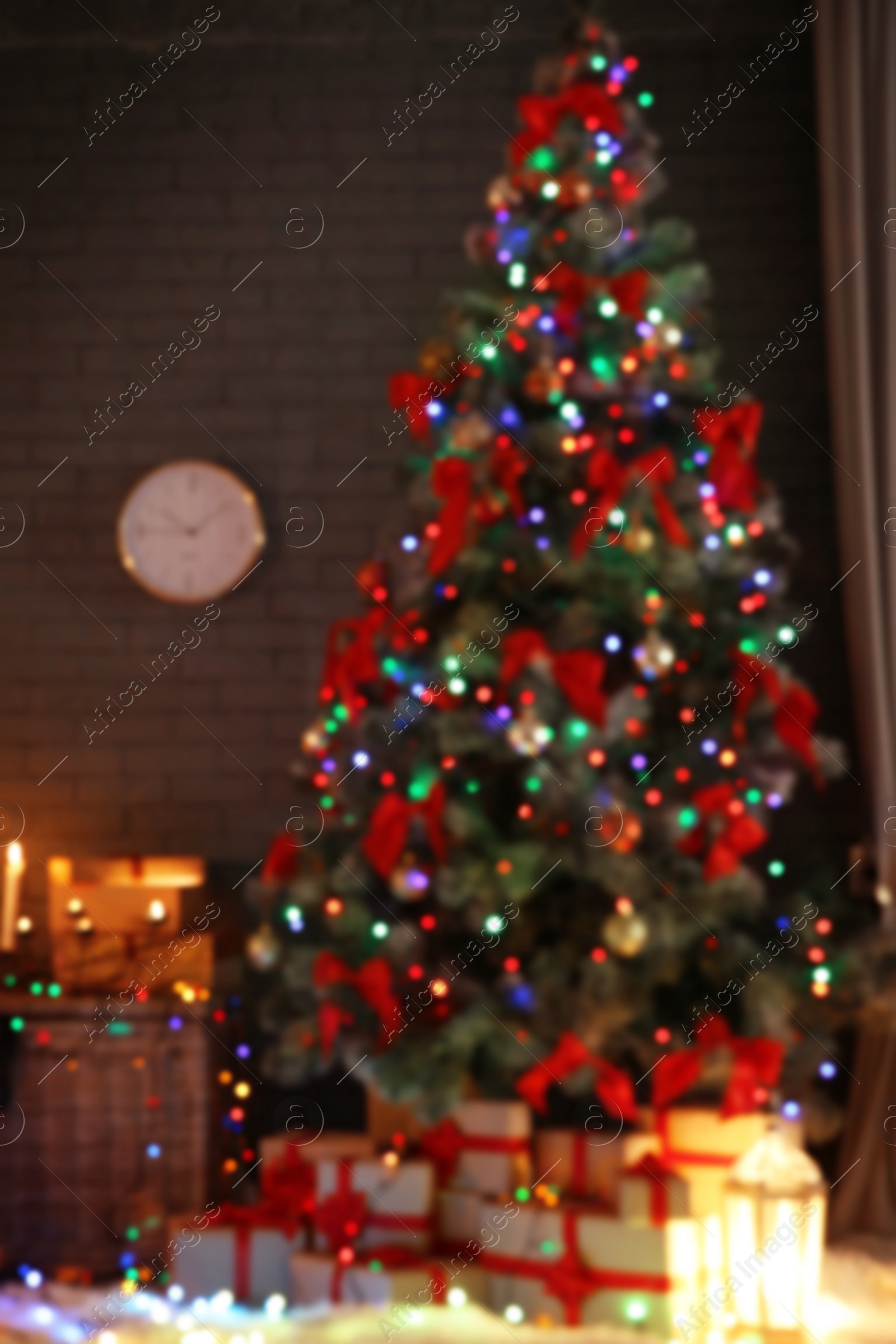 Photo of Blurred view of stylish room interior with decorated Christmas tree