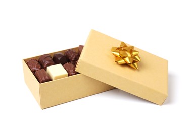 Photo of Box with tasty chocolate candies isolated on white