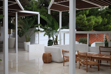 Photo of Terrace with outdoor furniture and green plants