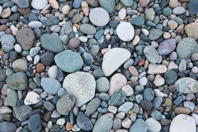 Photo of Many different pebbles as background, top view