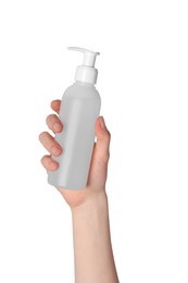 Woman holding bottle of face cleansing product on white background, closeup