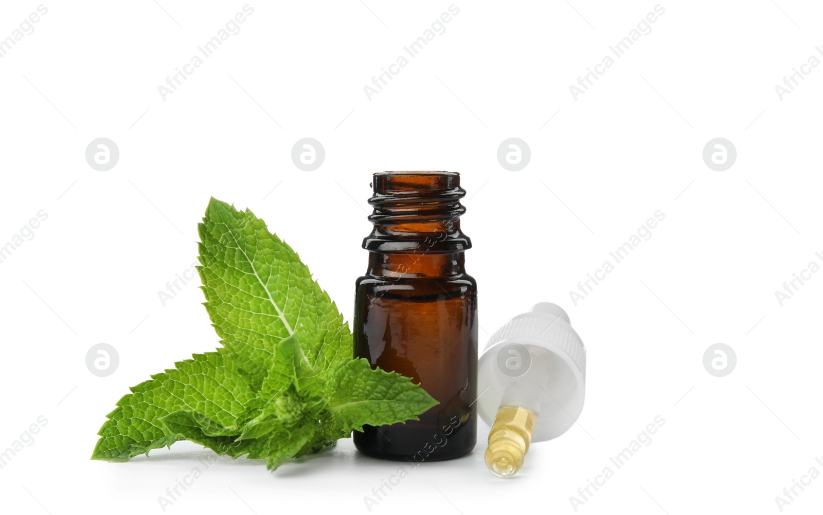 Photo of Bottle of essential oil and mint on white background