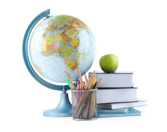 Photo of Plastic model globe of Earth, colorful pencils, apple and books on white background. Geography lesson