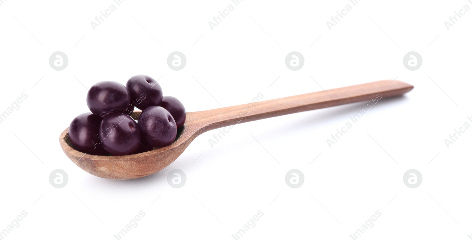 Photo of Fresh acai berries in wooden spoon isolated on white