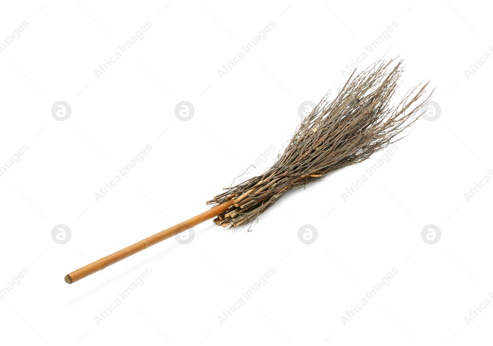 Photo of Old broom with wooden handle isolated on white