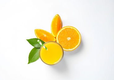 Photo of Glass of orange juice and fresh fruits on white background, top view