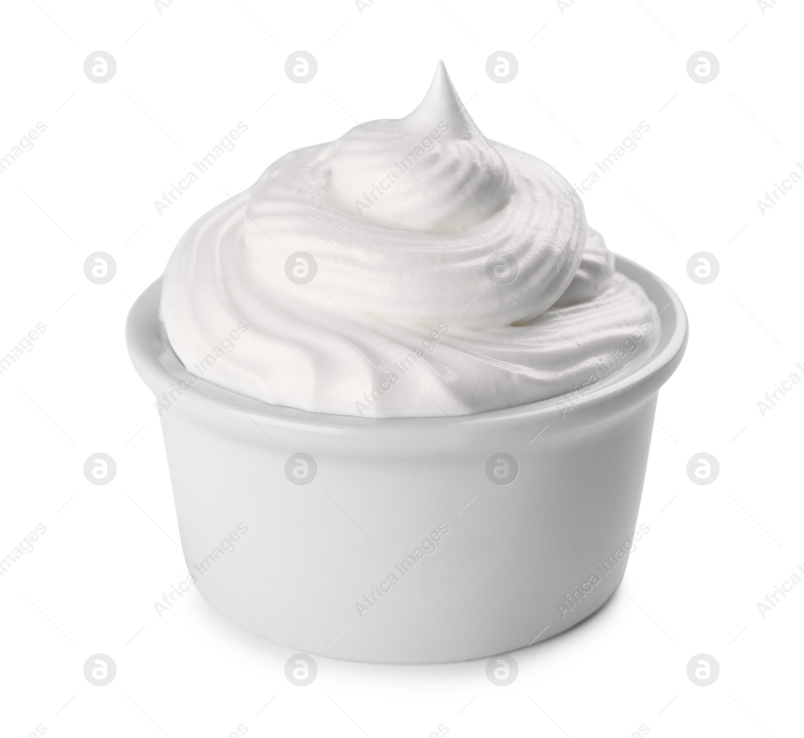 Photo of Fresh whipped cream in bowl isolated on white