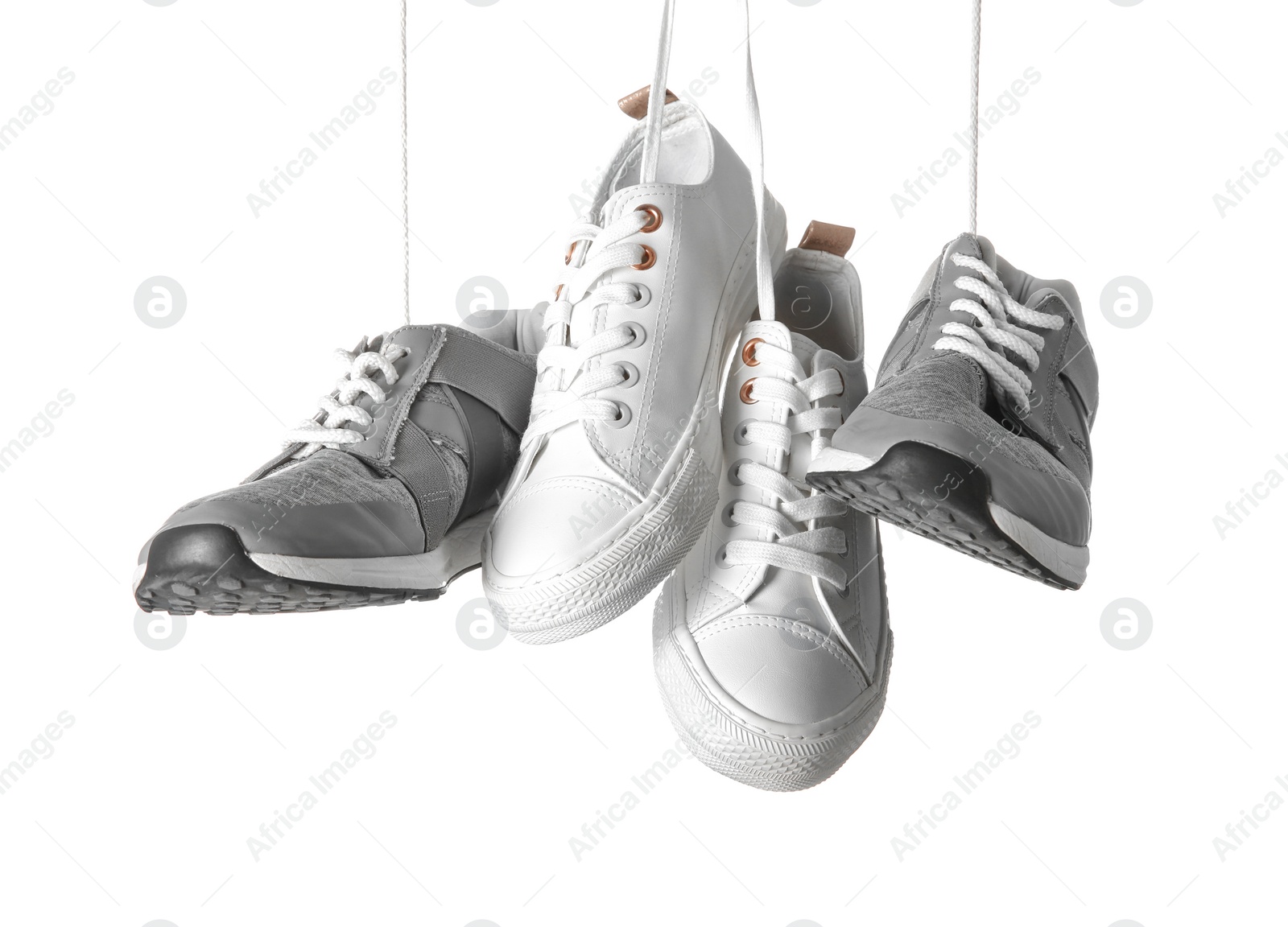 Photo of Different shoes on white background