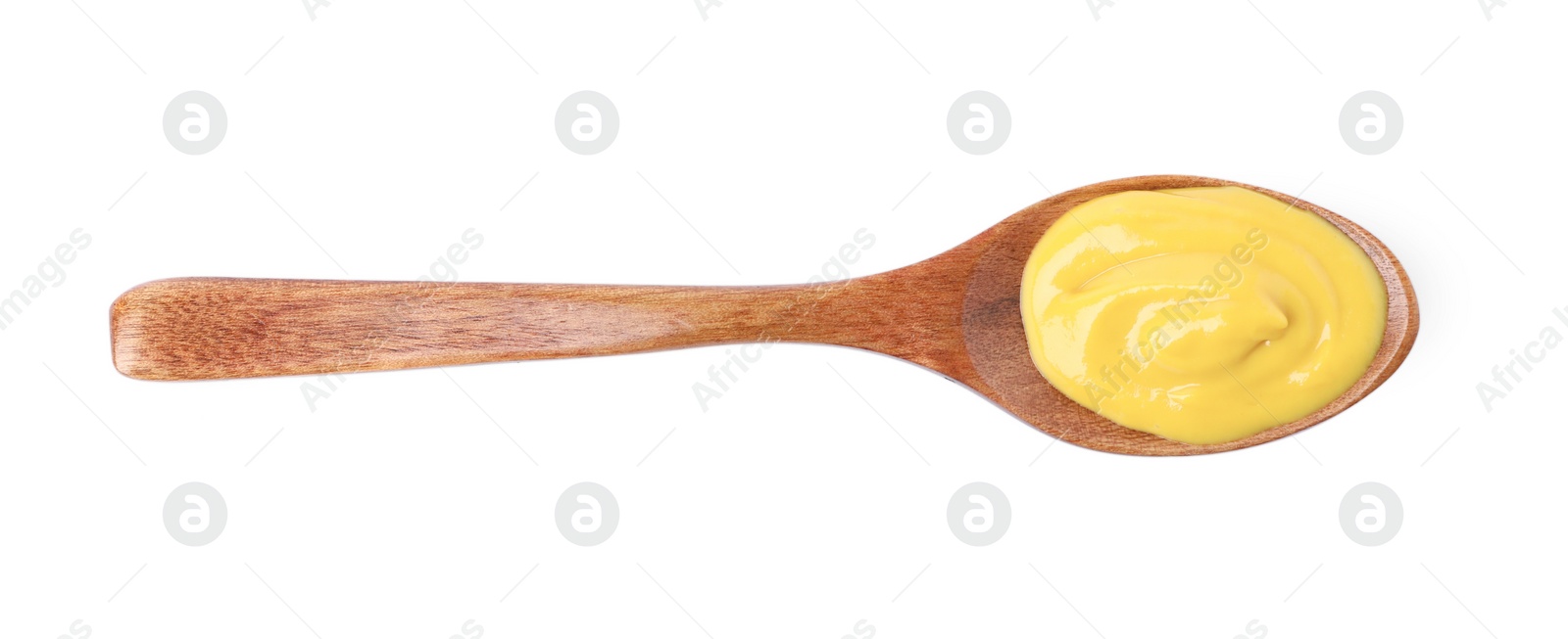 Photo of Delicious mustard in wooden spoon isolated on white, top view