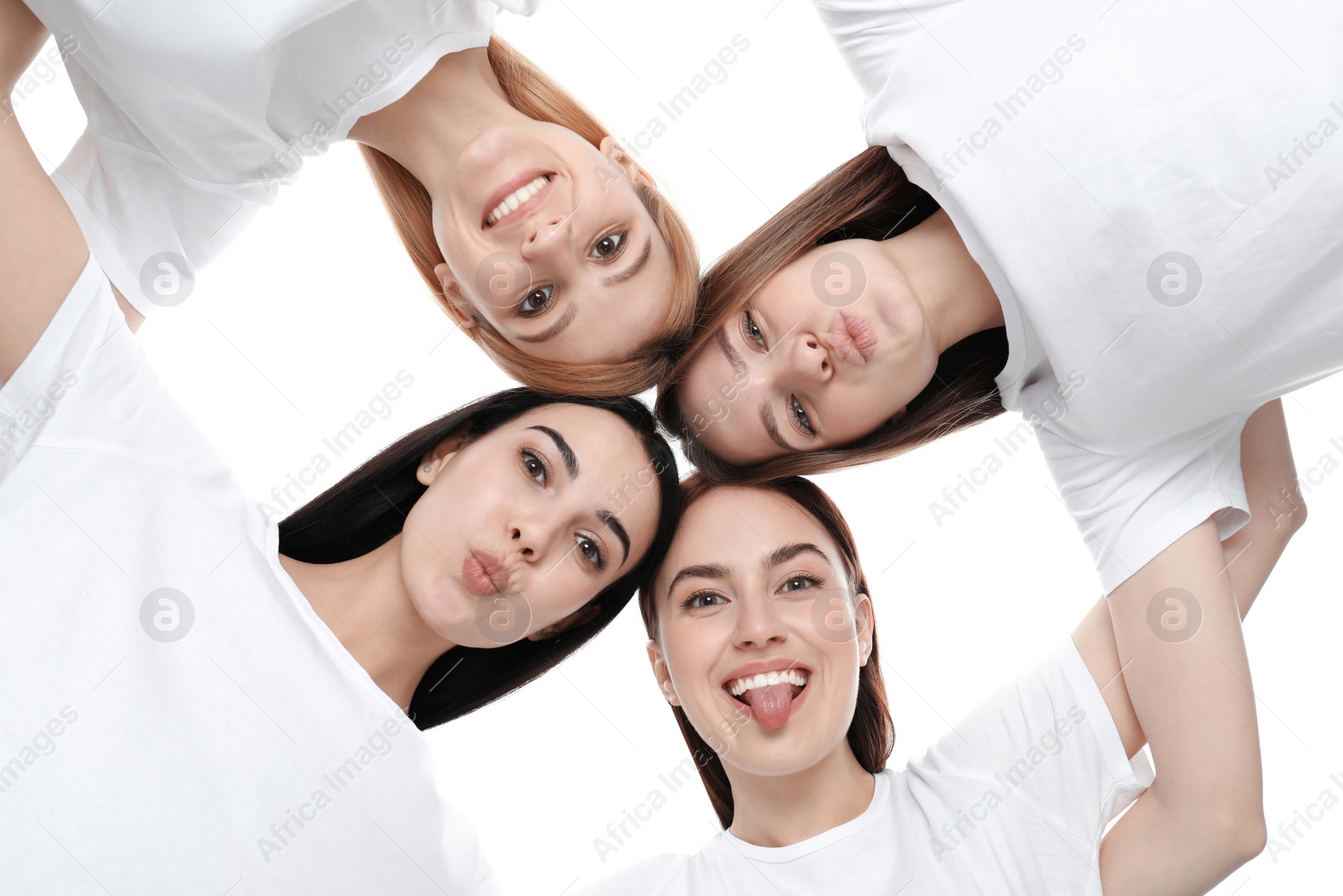 Photo of Beautiful young ladies hugging on white background, bottom view. Women's Day