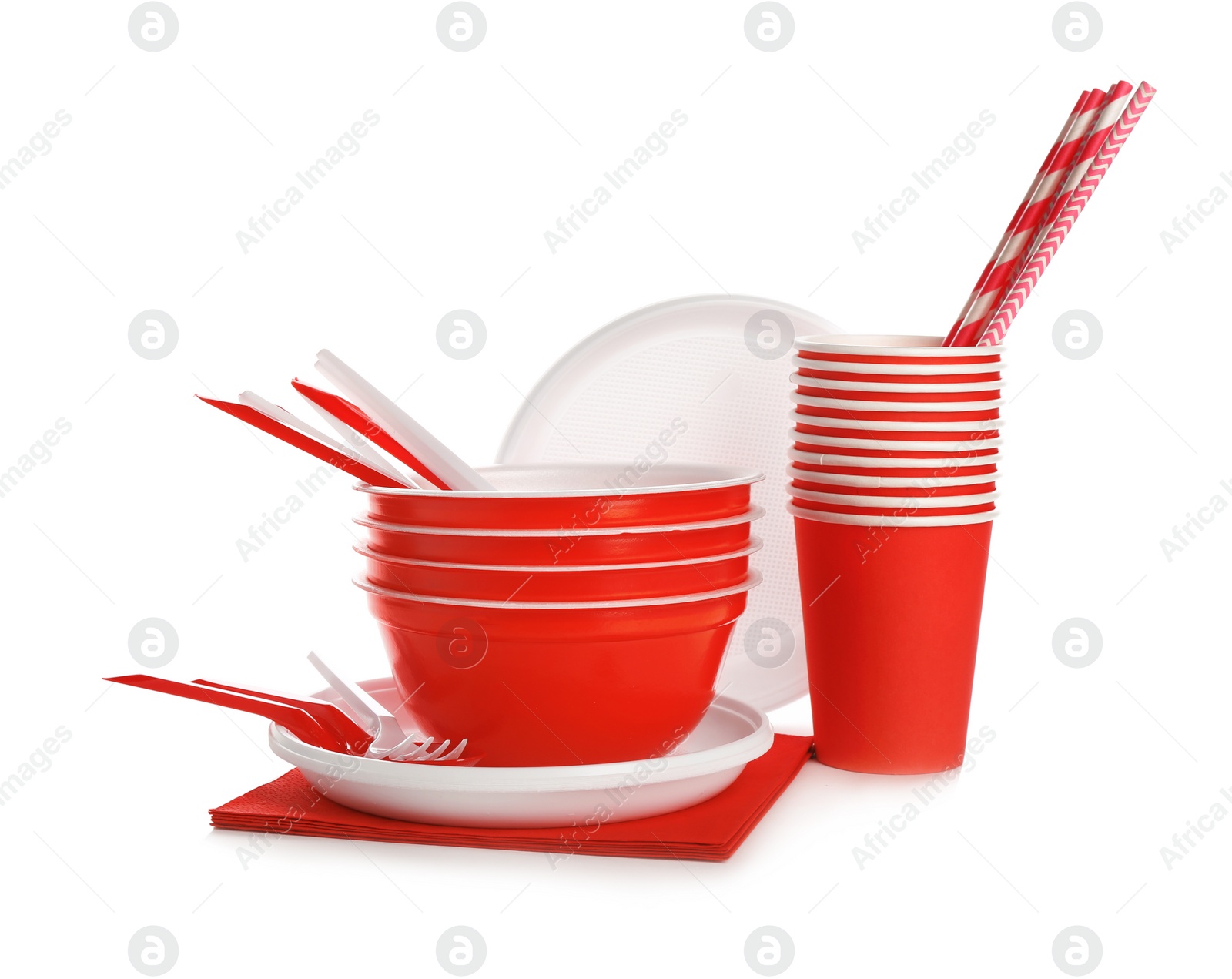 Photo of New plastic dishware and napkins on white background. Table setting