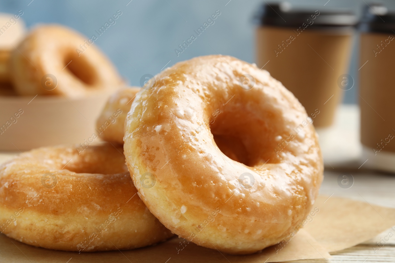 Photo of Sweet delicious donuts on table, closeup view