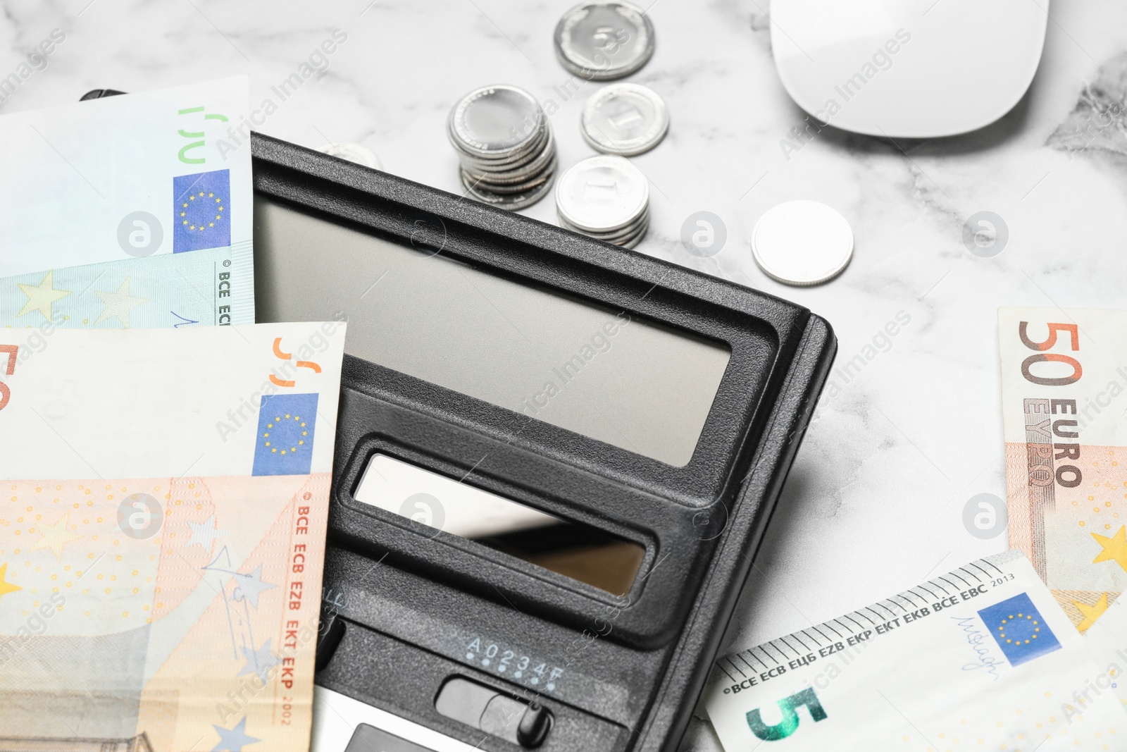 Photo of Calculator and money on marble background, closeup. Tax accounting