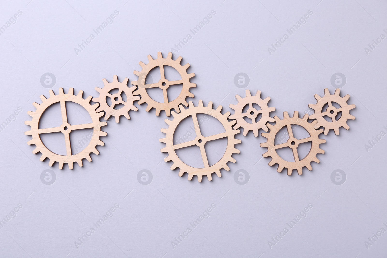 Photo of Business process organization and optimization. Scheme with wooden figures on light background, top view