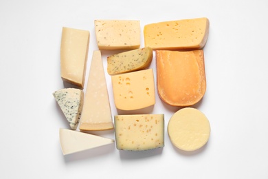Photo of Composition with different kinds of tasty cheese on white background, top view