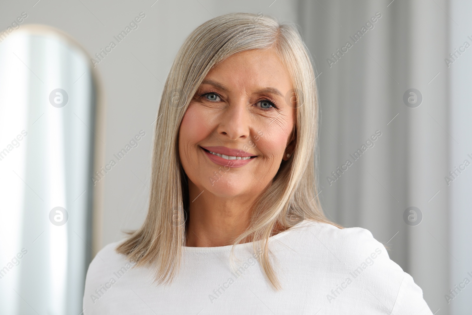 Photo of Portrait of beautiful middle aged woman indoors