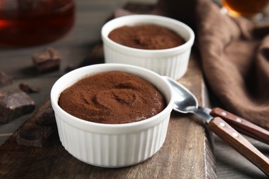 Delicious fresh chocolate fondant on wooden board, closeup