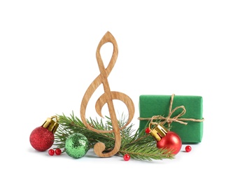 Photo of Treble clef with decorations isolated on white. Christmas music concept