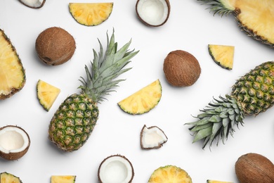 Photo of Composition with pineapple and coconut on white background, top view