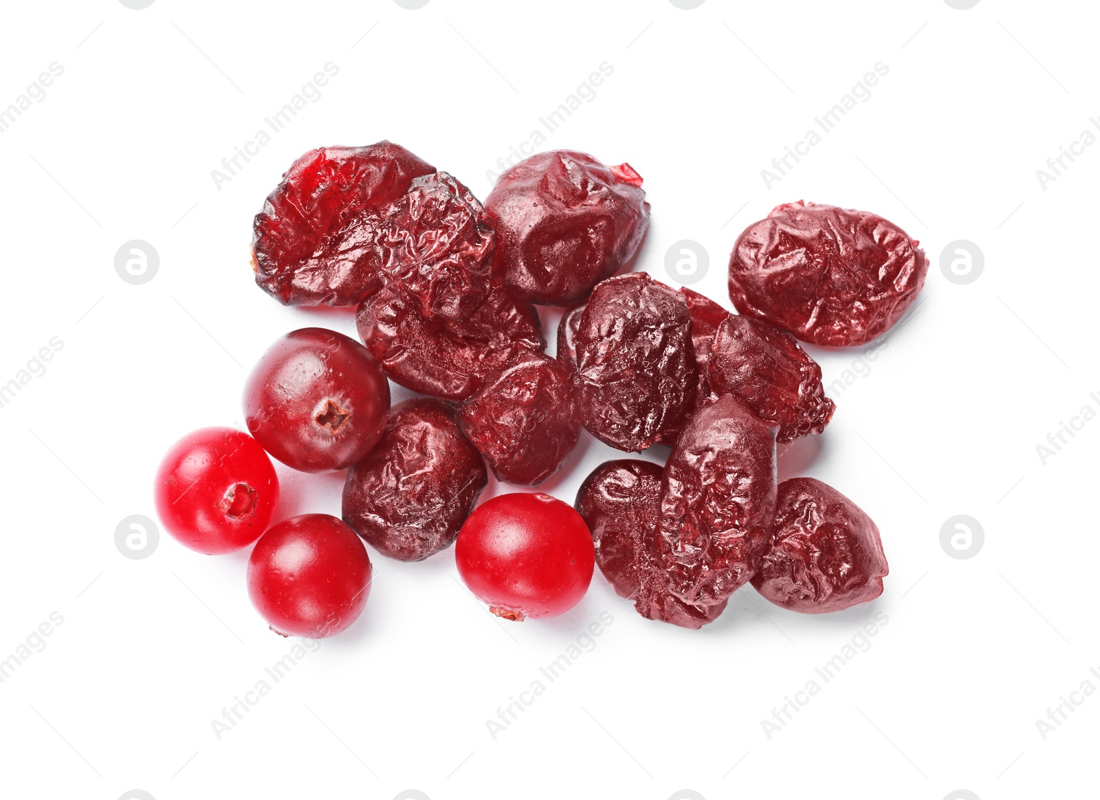 Photo of Pile of tasty dried and fresh cranberries isolated on white, top view