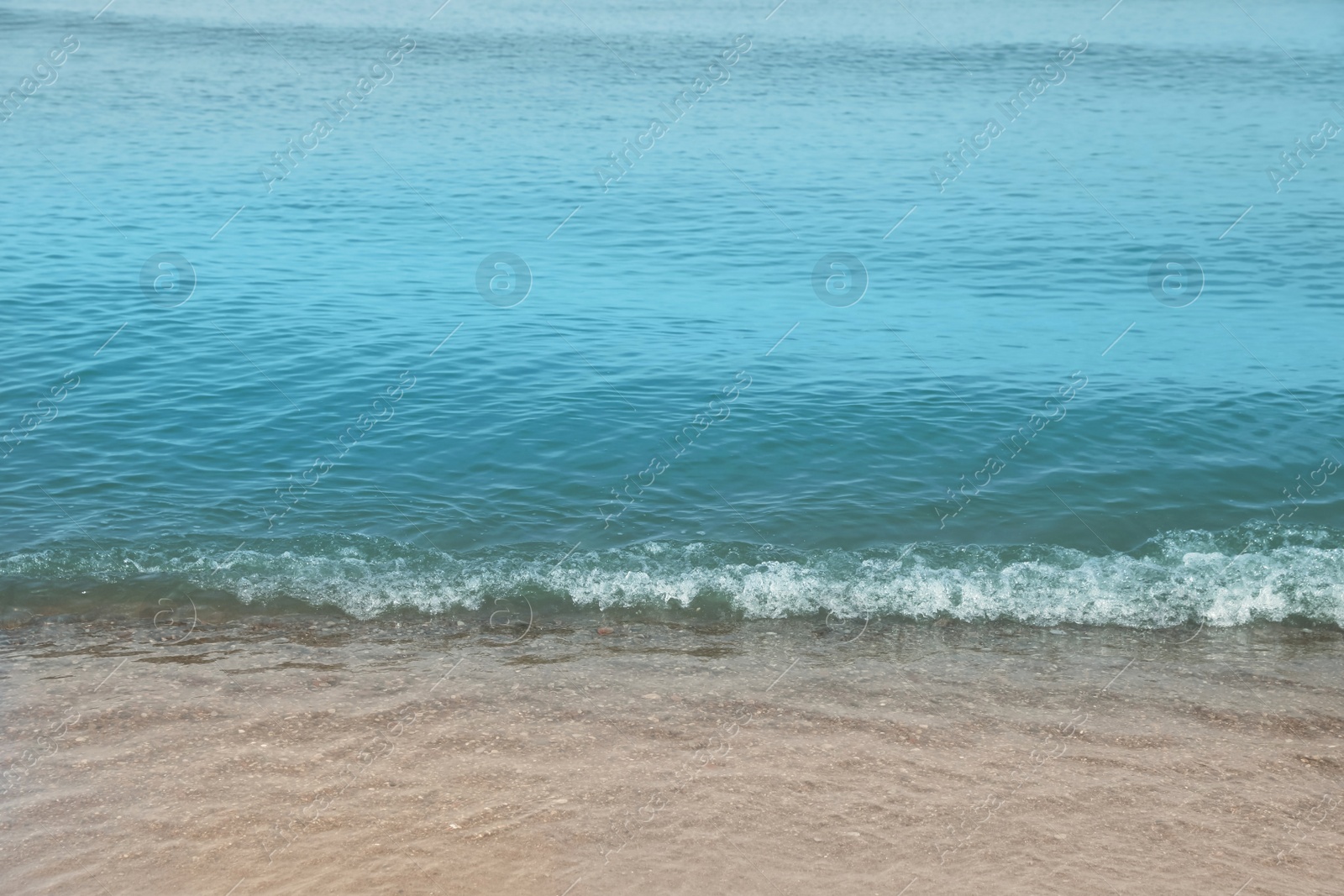 Photo of Beautiful view of sea shore under blue sky on sunny day