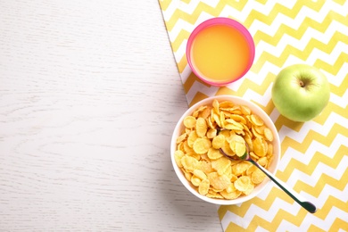 Photo of Flat lay composition with cornflakes on white wooden table, space for text. Healthy breakfast