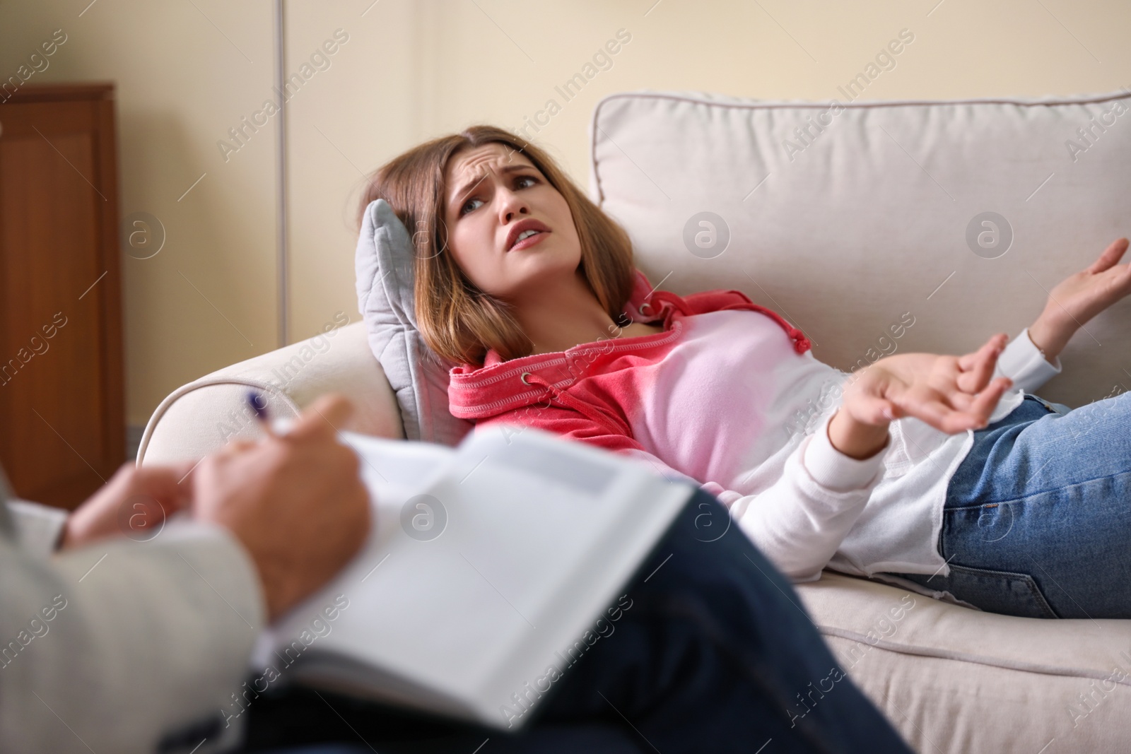 Photo of Professional psychotherapist working with patient in office