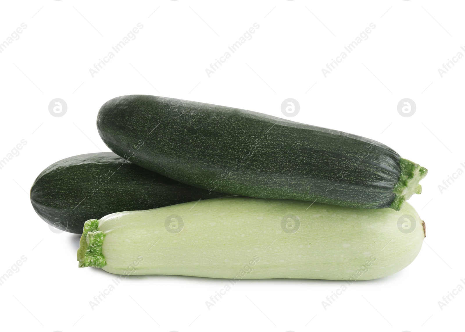 Photo of Fresh ripe green zucchinis isolated on white