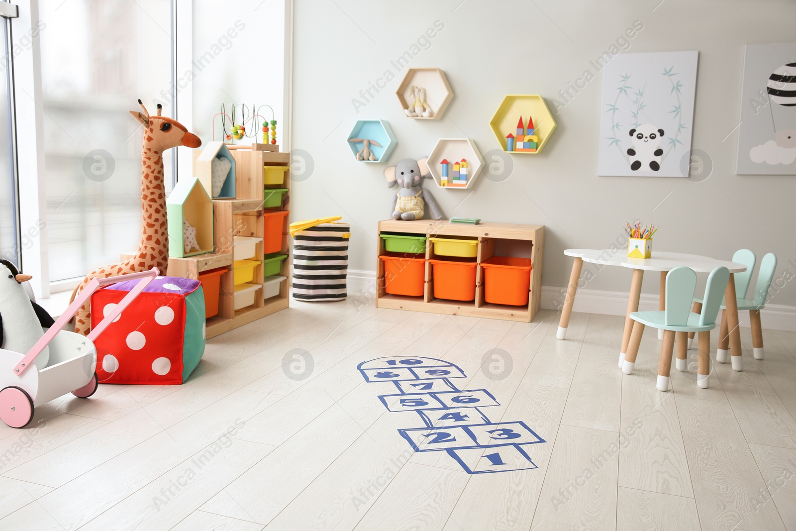 Photo of Blue hopscotch floor sticker in playing room