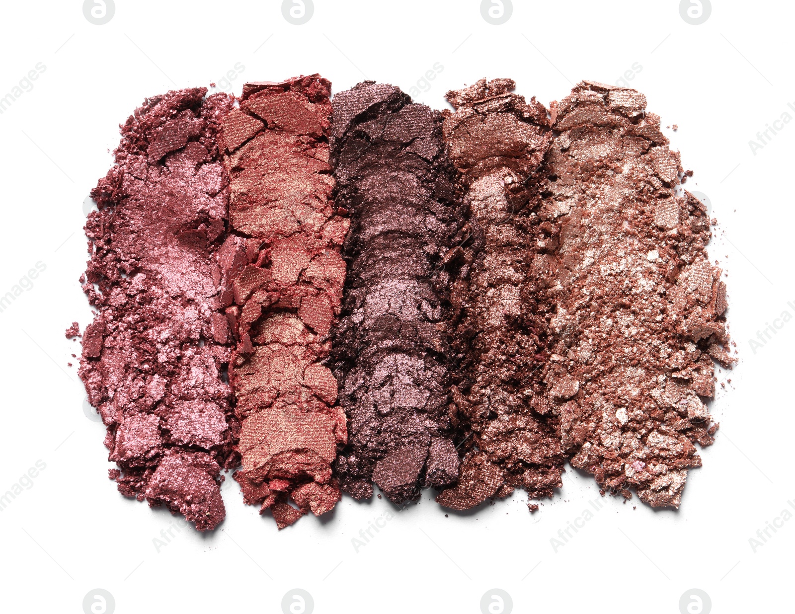 Photo of Different crushed eye shadows on white background, top view. Professional makeup product