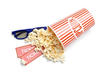 Bucket of fresh popcorn, tickets and 3D glasses on white background, top view. Cinema snack