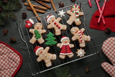 Photo of Flat lay composition with delicious Christmas cookies on black table