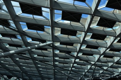 Photo of Low angle view of overhang glass ceiling. Modern design